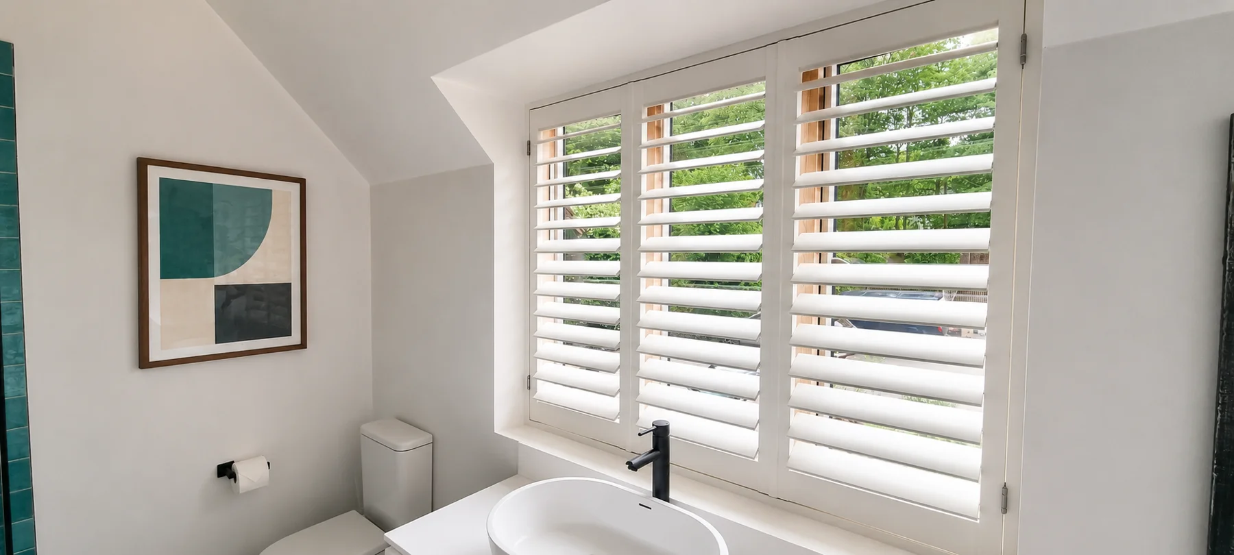 White full-height shutters above a bathroom basin