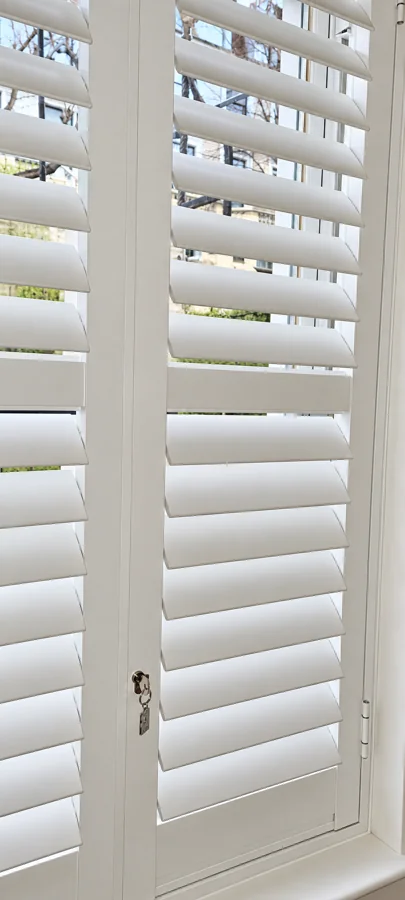 Close-up of white aluminium security shutter louvres