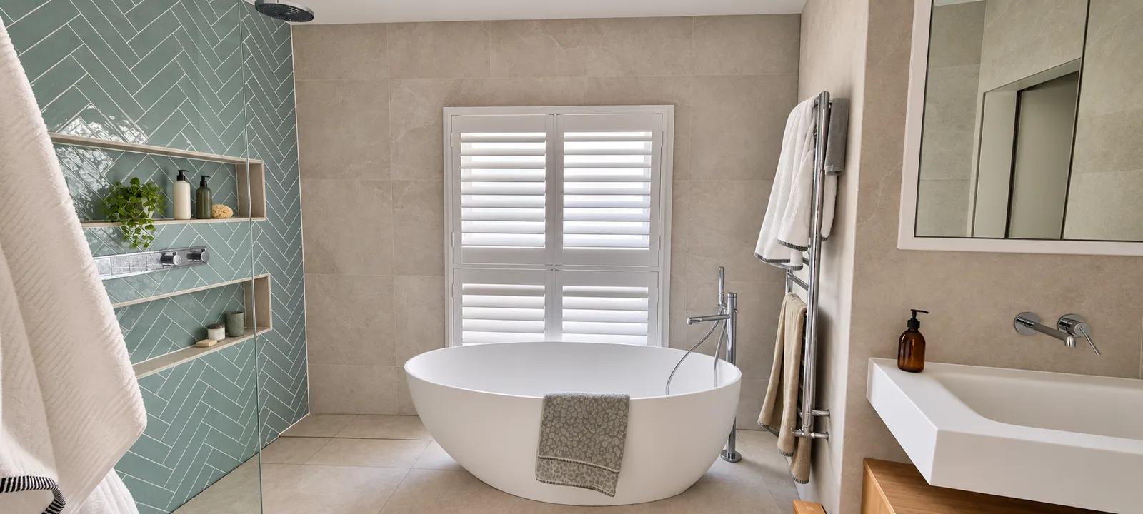 White shutters above a freestanding bath