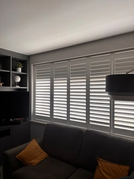 Large Pure White Hardwood living-room shutter with 76mm louvres in Aylesbury