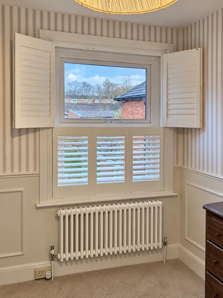 Tier-on-tier shutters with upper panels open and lower panels closed in Basingstoke
