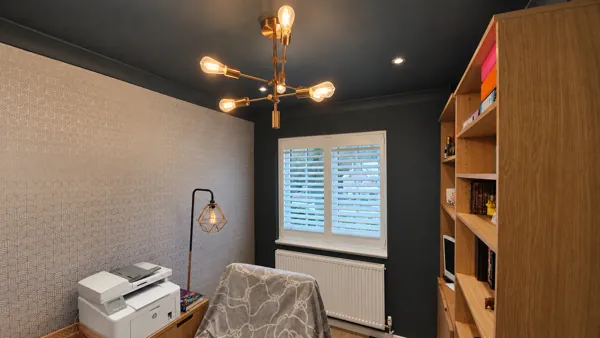 White Hardwood shutters contrasting with a dark home office in High Wycombe